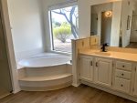 master bathroom with roman tub and double sinks